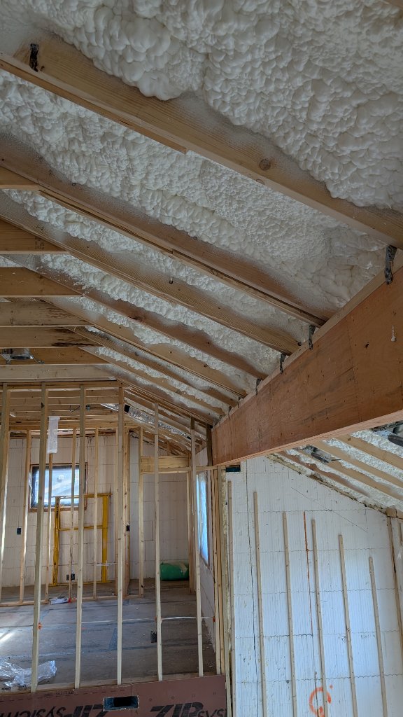 Vaulted living room with spray foam insulation