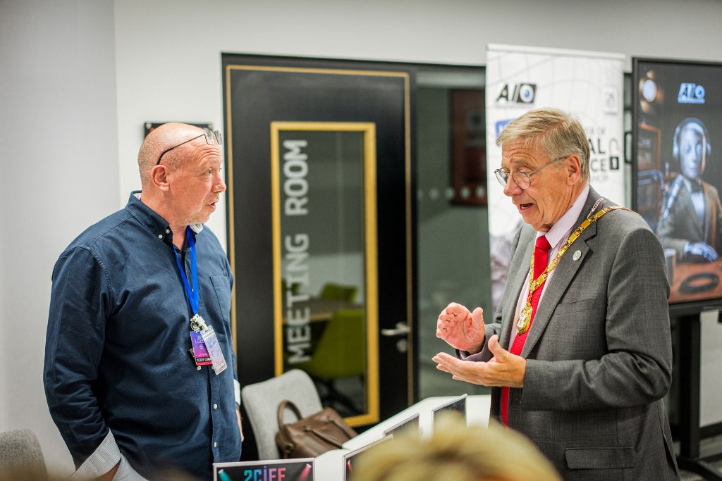 The Mayor of Milton Keynes speaking with a guest