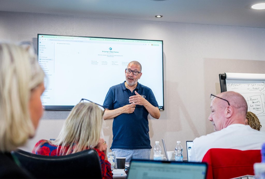 Trainer pointing at YouTube Studio on screen