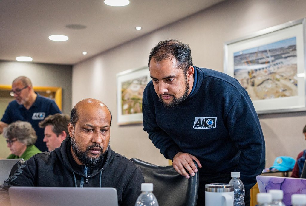 Attendee working on laptop at workshop