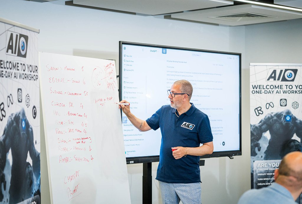 Trainer coaching attendee at screen