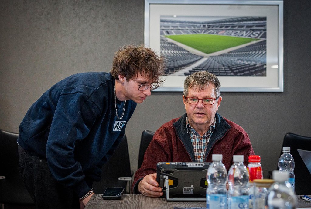 Trainer coaching attendee one-to-one