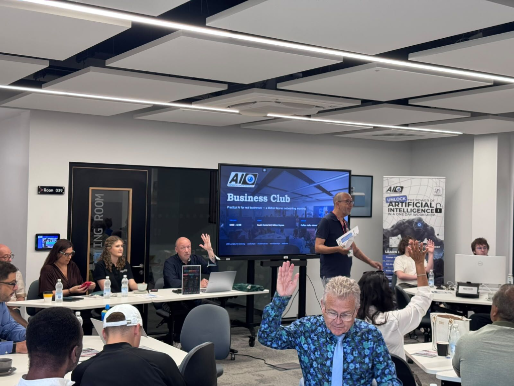 Attendees seated at round tables during the AI Cyclops Business Club networking morning at SCIoT