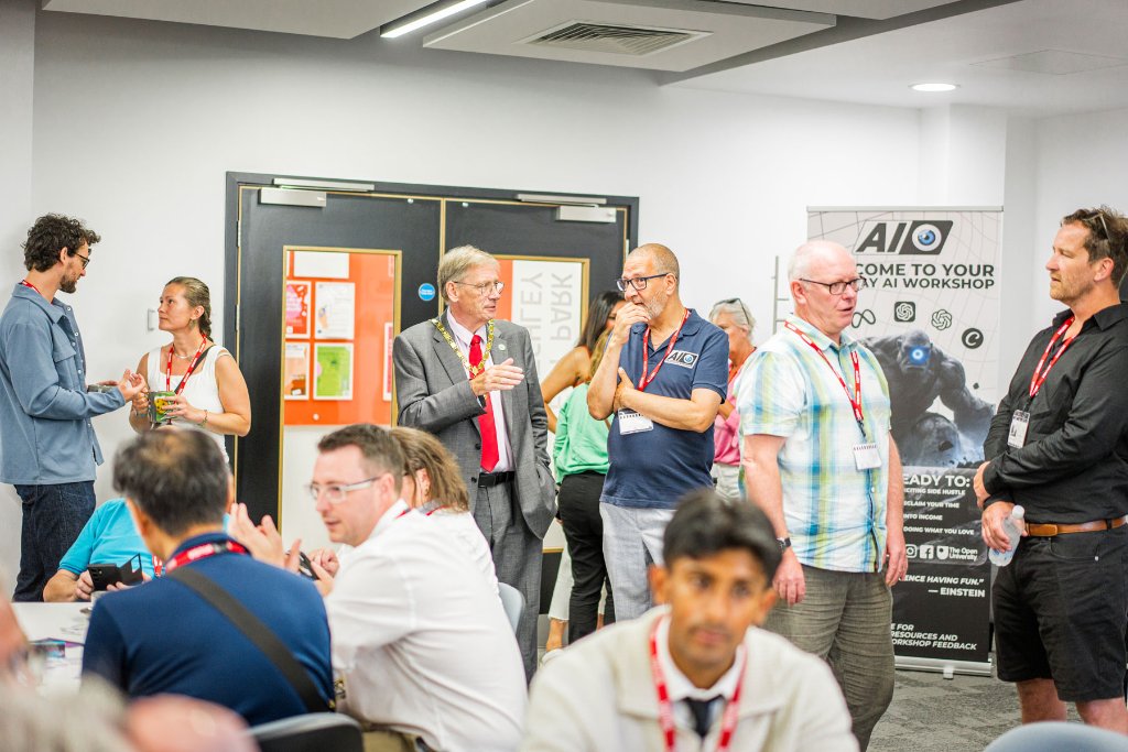Business professionals networking and conversing in small groups at the event