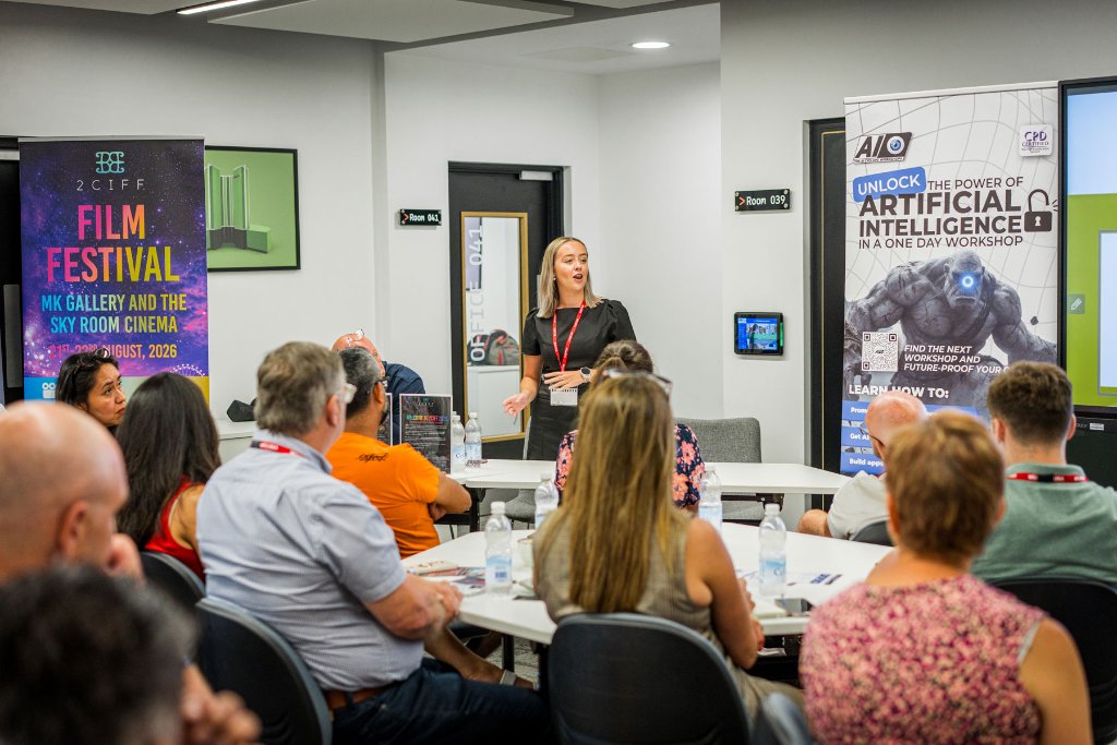 A host presenting to attendees