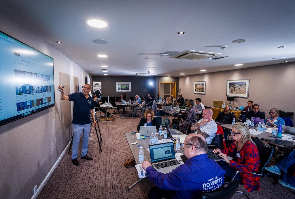 Trainer presenting to packed workshop room