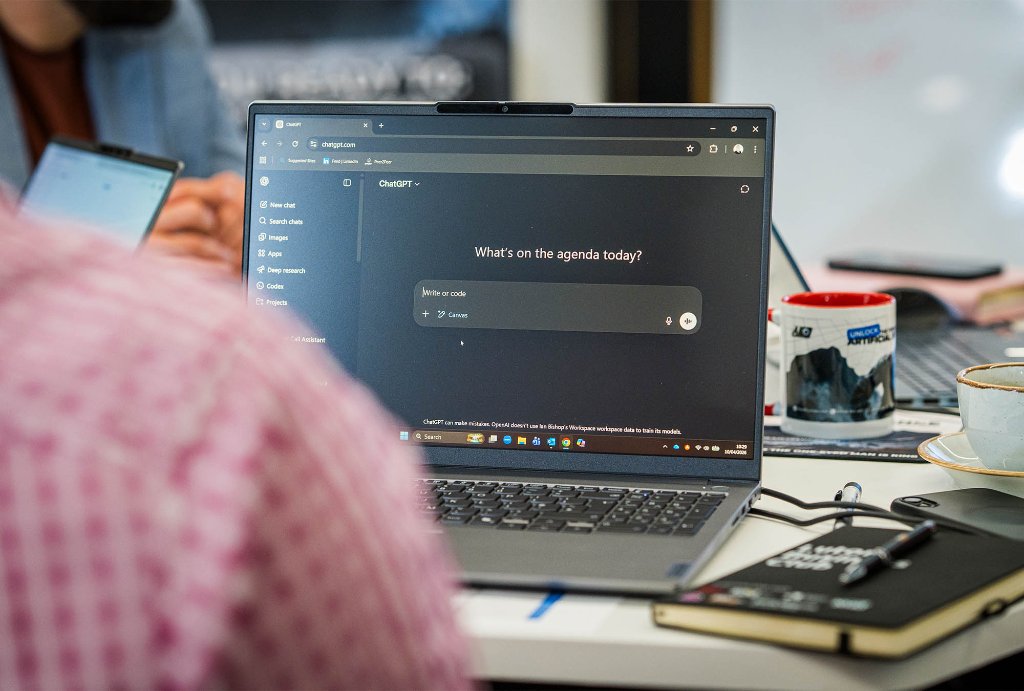 Attendee focused at laptop