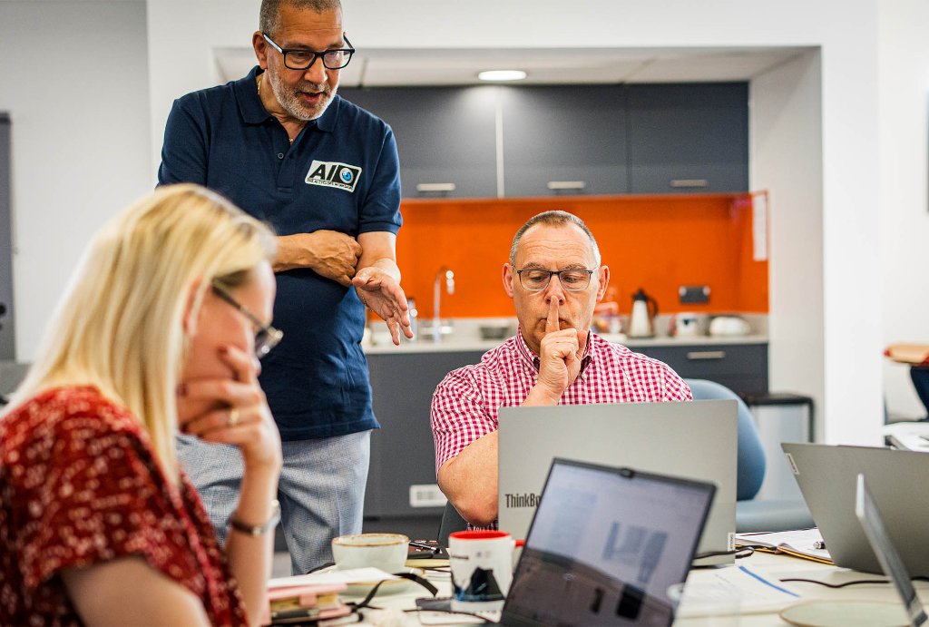 Workshop attendee focused at laptop