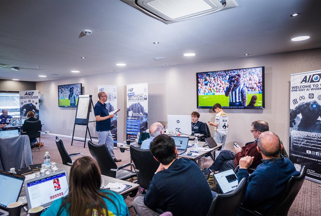 Trainer presenting to small group with AI banners