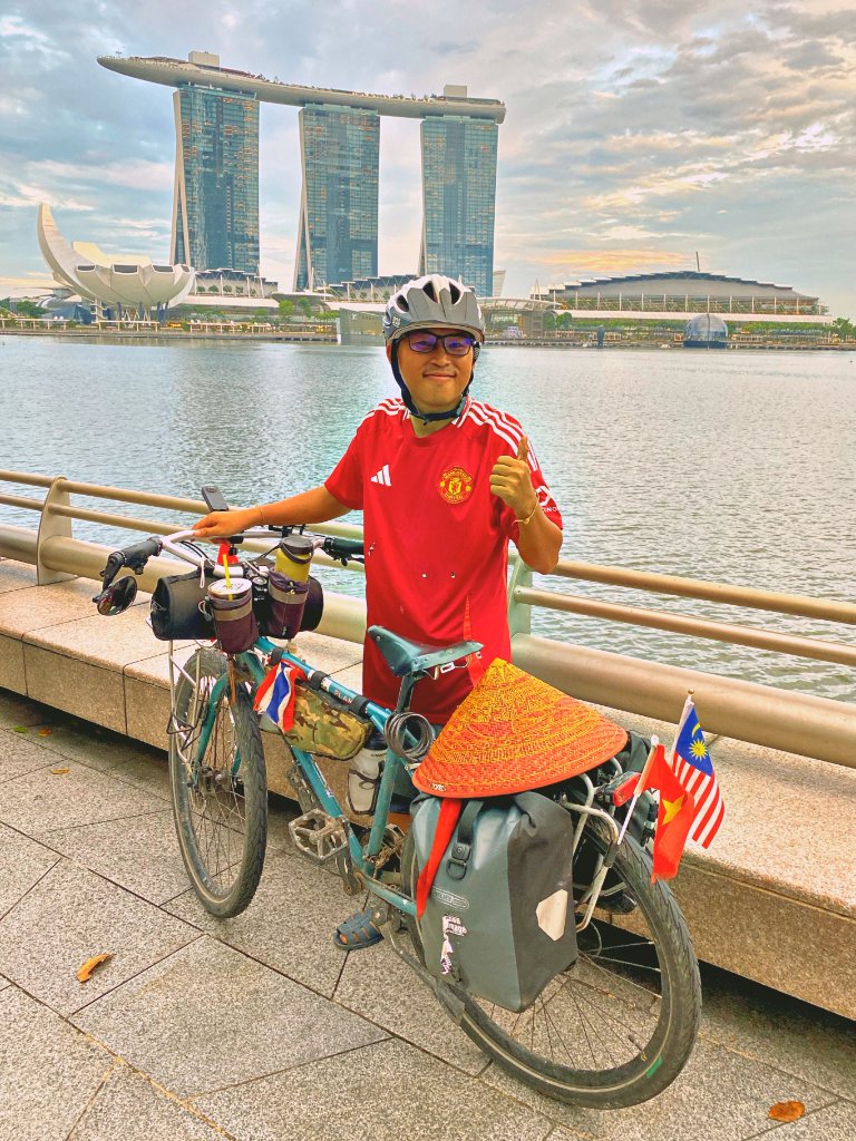 Gom in Singapore with Marina Bay Sands behind him