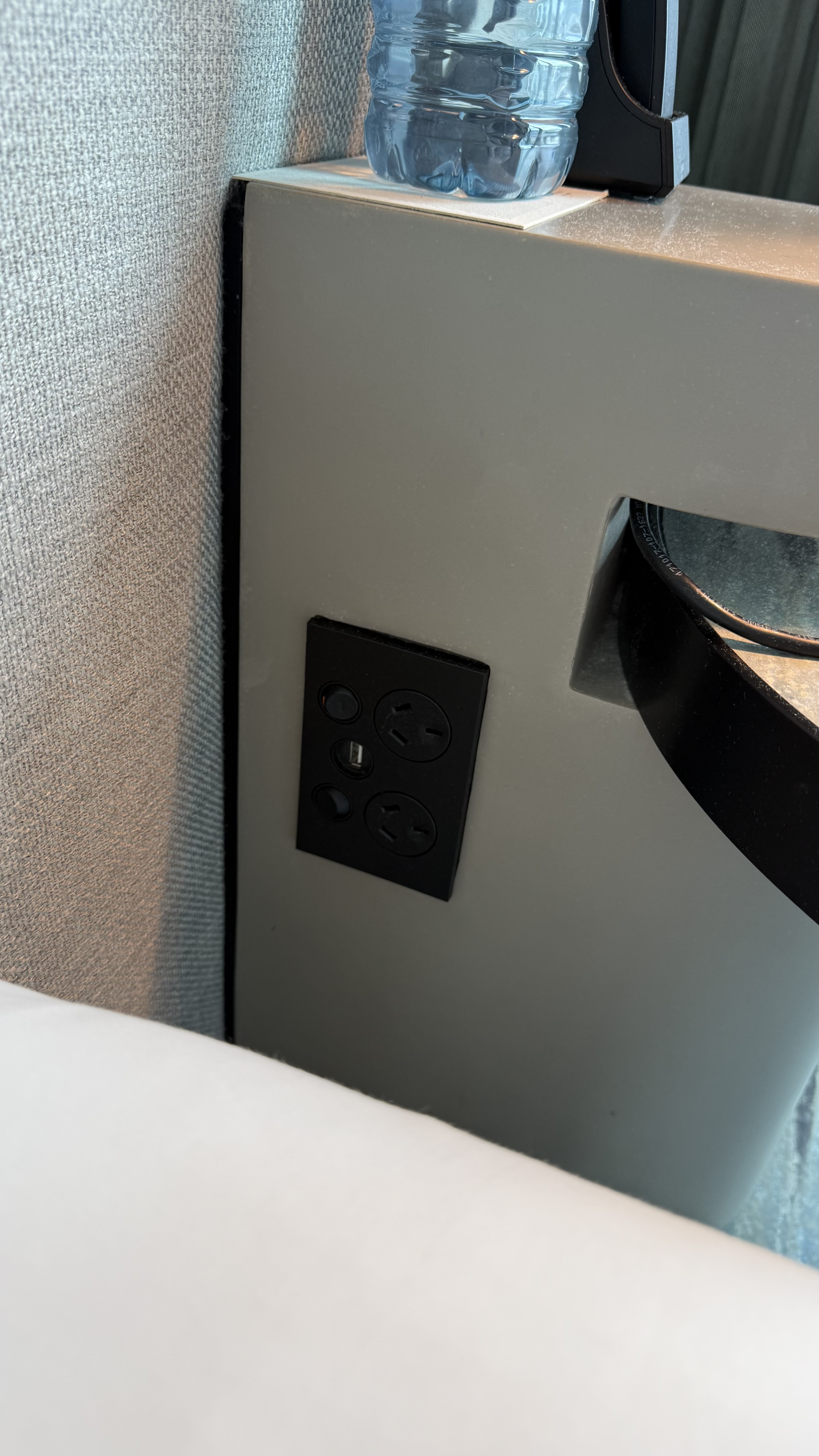 USB and plug sockets built into the bedside panel — both sides of the bed