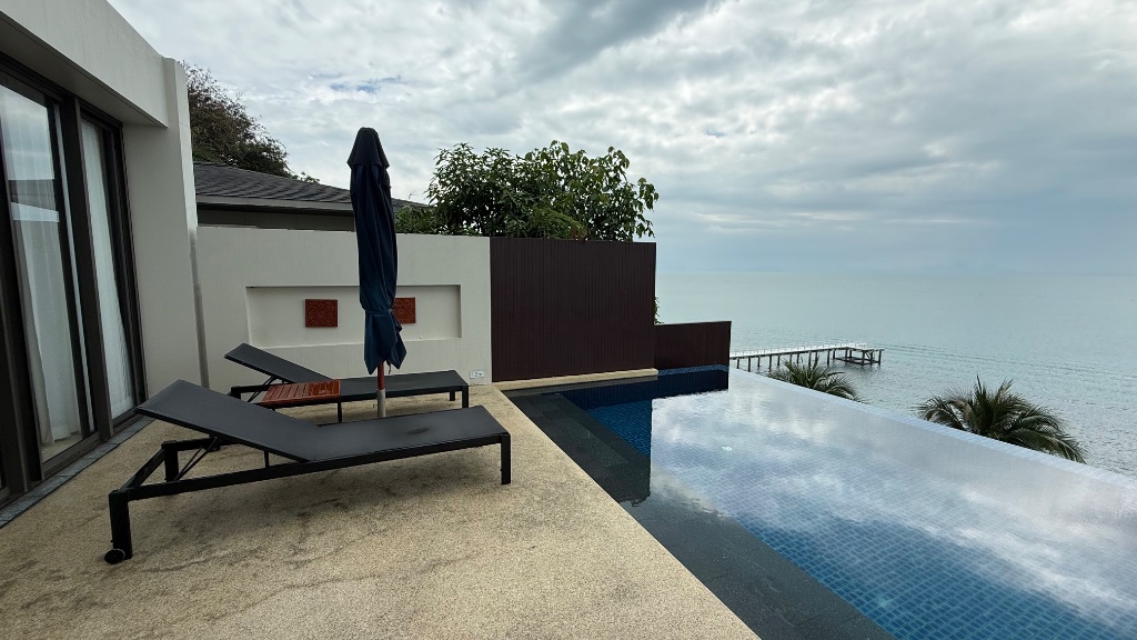The villa infinity pool and sun loungers