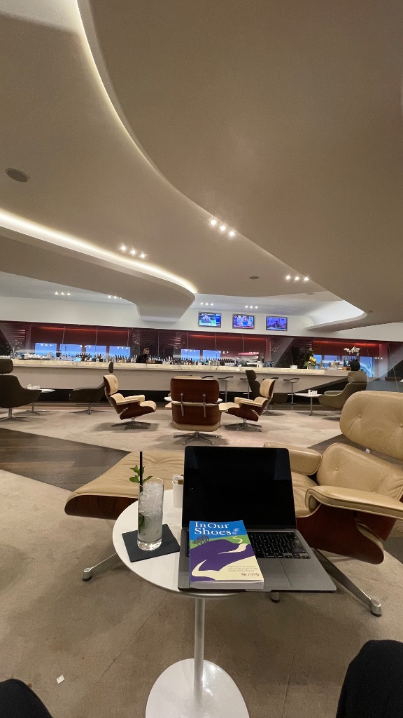 The Clubhouse bar — Eames chairs, a cocktail menu, and a mojito to start