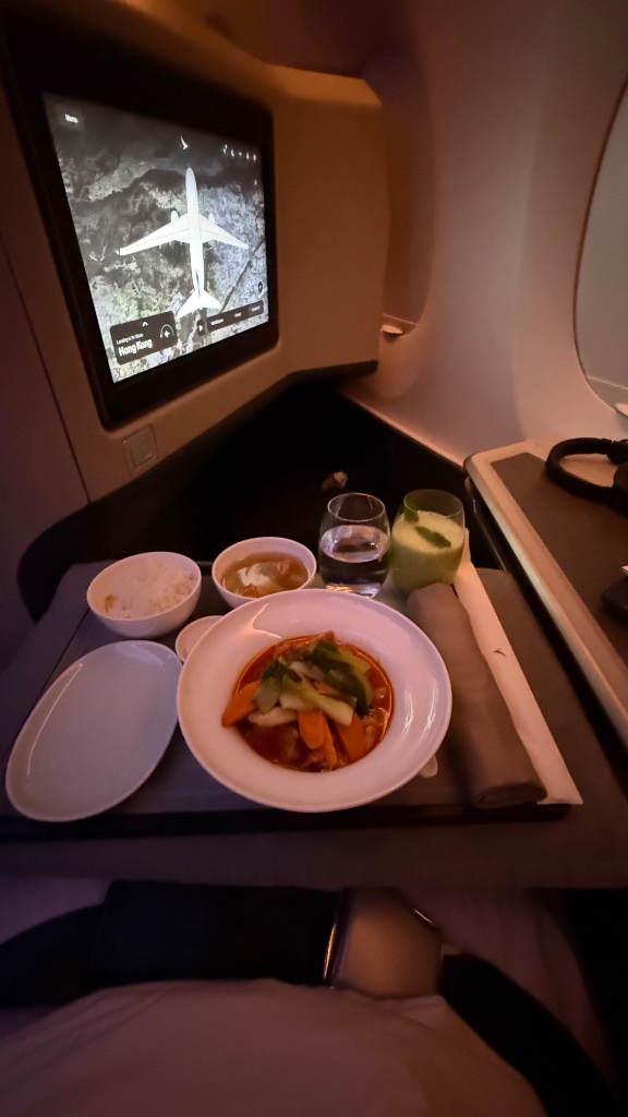 Cathay A350-900 business cabin — quiet and composed before the red-eye