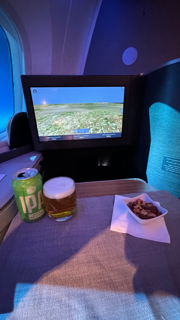 Pre-dinner drinks — an IPA and mixed nuts; the beer is far better than the champagne