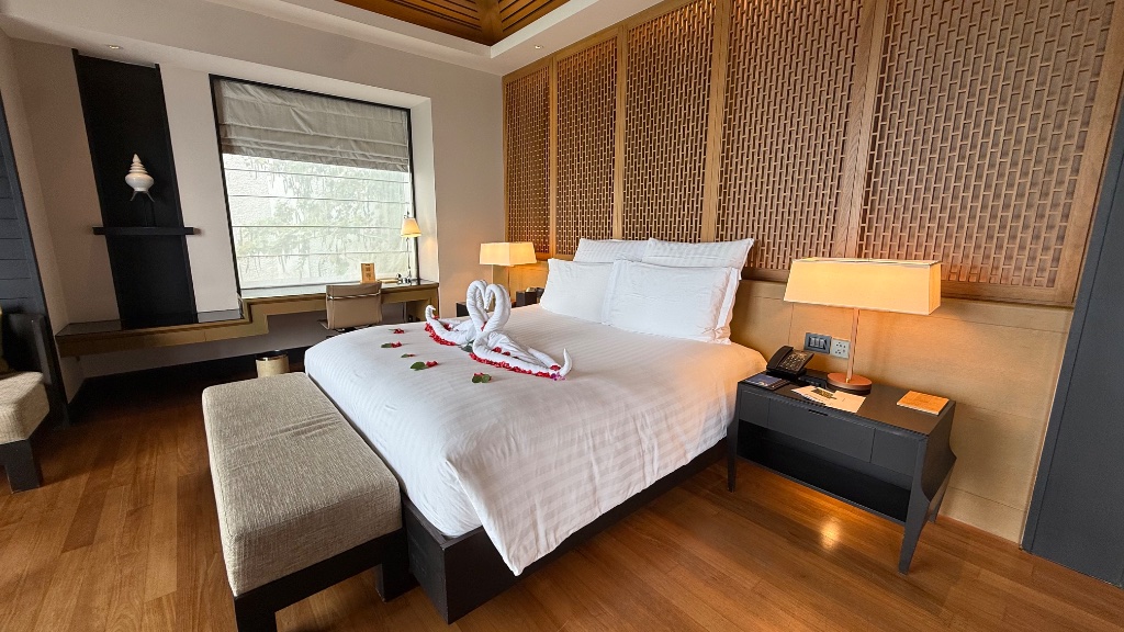 The villa bedroom with towel swans and rose petals