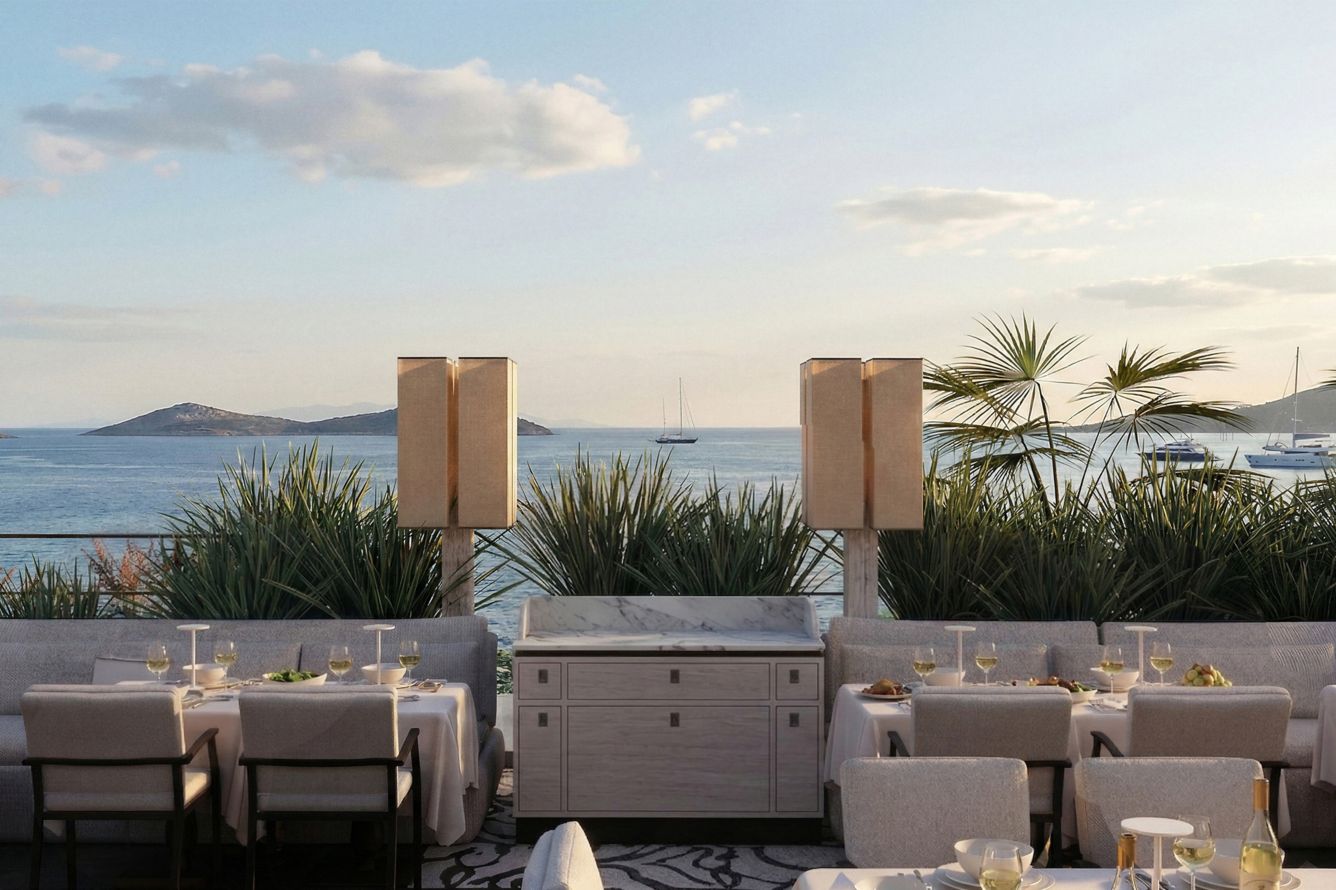 The Aegean restaurant — terrace dining with Aegean island views at sunset