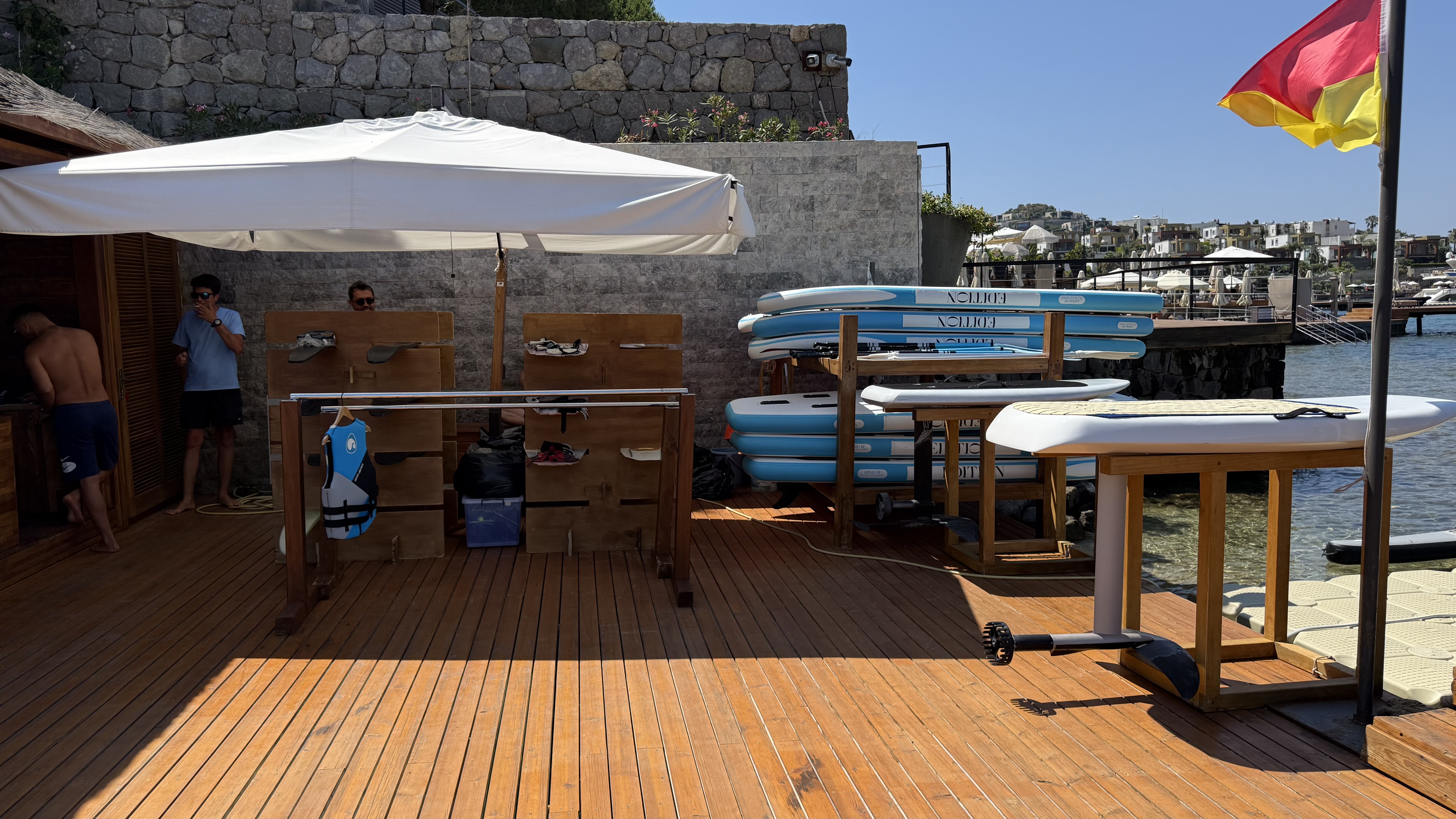 The water sports centre — SUP boards, kayaks and jet skis available from the dock