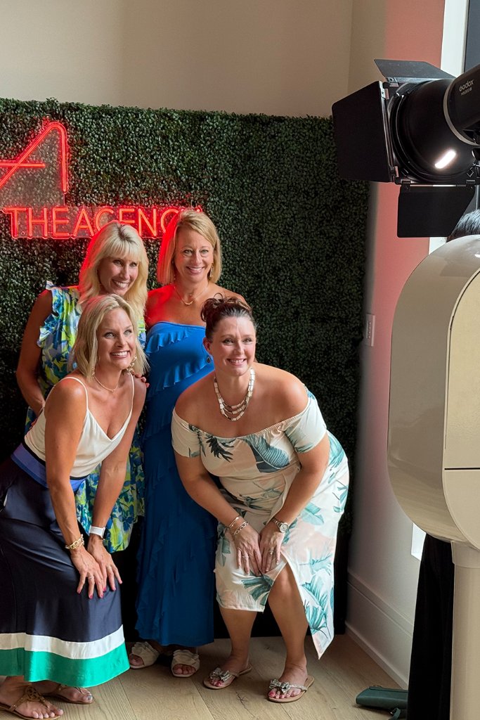 Guests posing at The Agency brand activation photo booth in Indianapolis