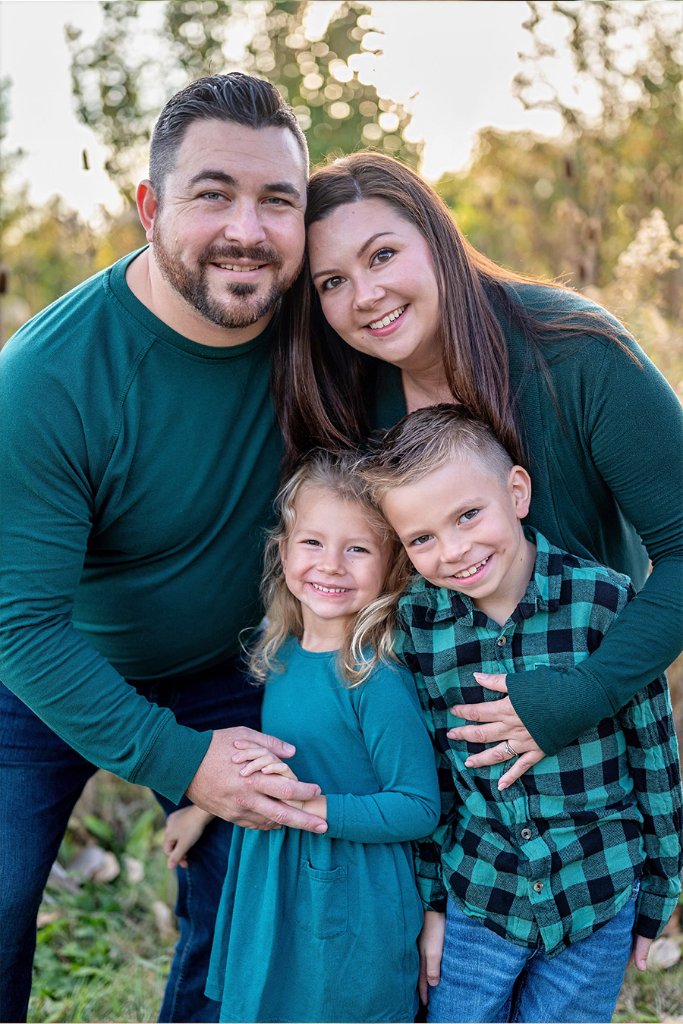 Daniel and Caitlin, founders of Rejoice Booth Indianapolis, with their family