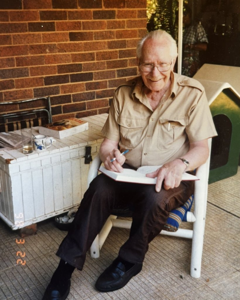 Norm Lee portrait writing in journal