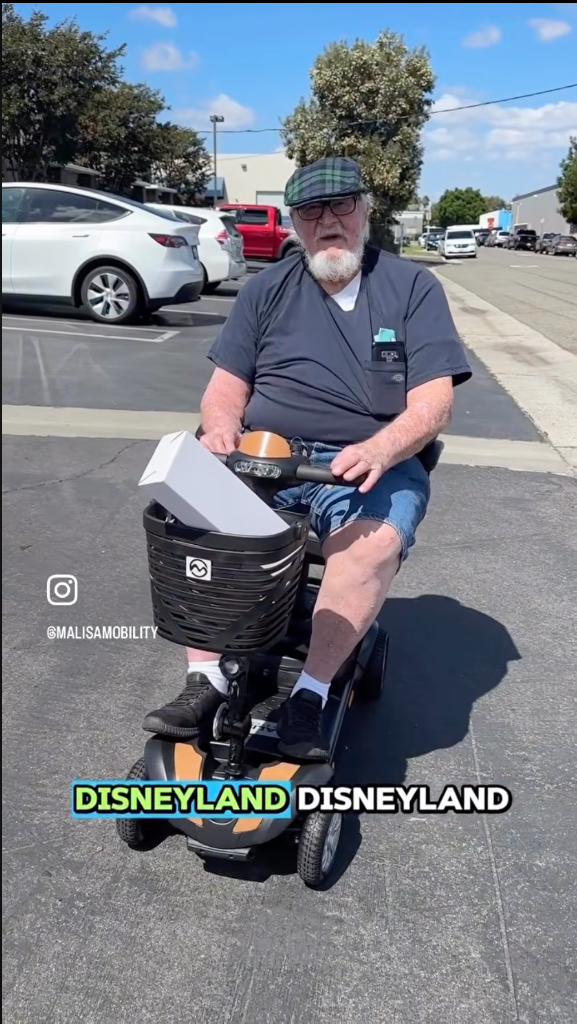 Happy customer at Disneyland on MLS-1 scooter