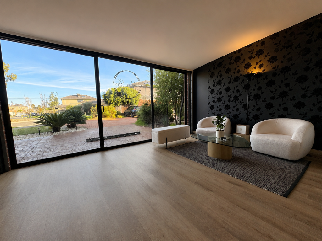 Wide view of Melbourne photography studio with lounge seating and glass doors