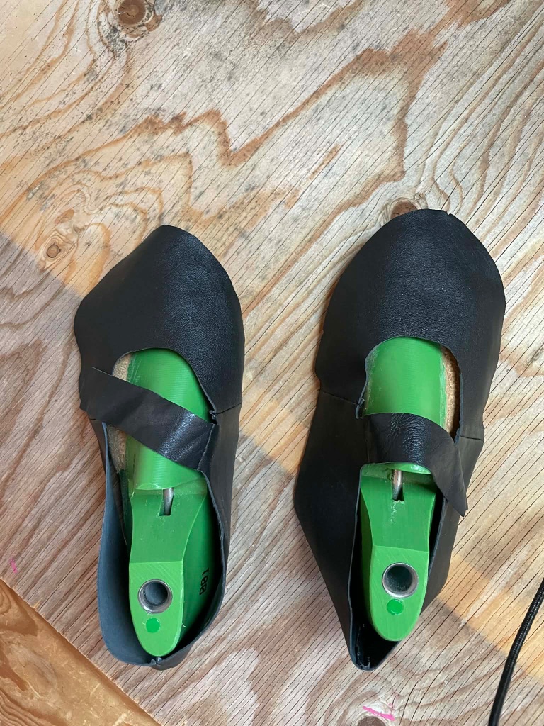 Black shoes on lasts