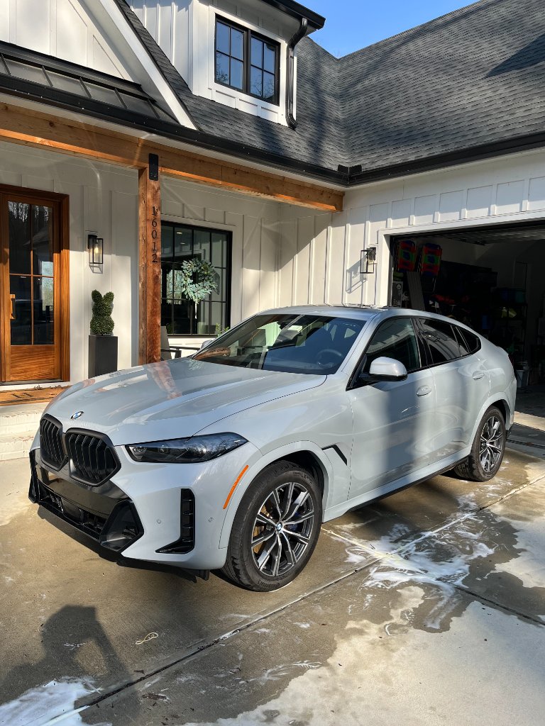 Ceramic coating application showing deep liquid glass finish