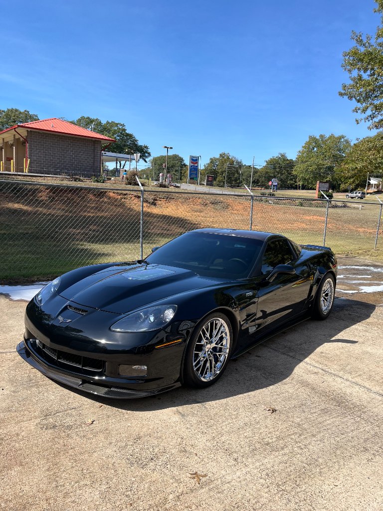 Luxury vehicle with flawless detailed finish in architectural setting