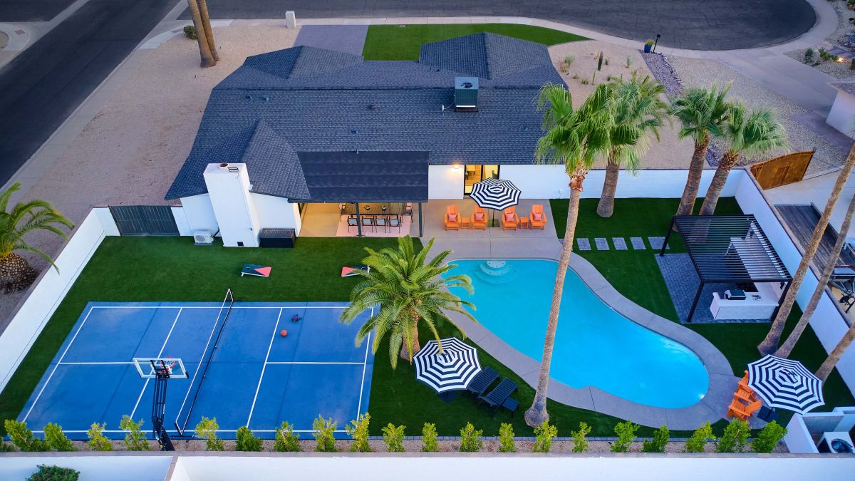Aerial backyard with pool and sport court