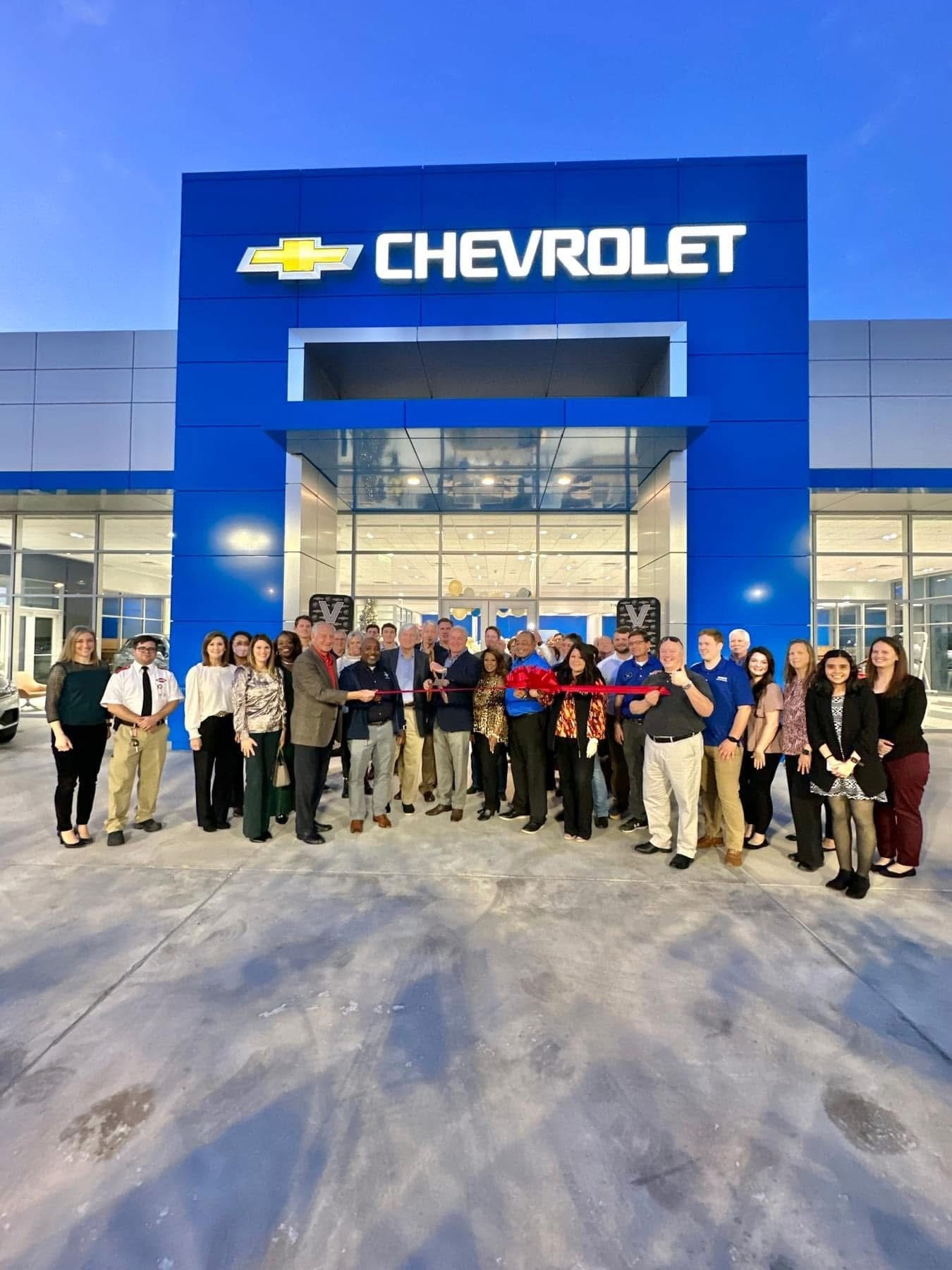 Ribbon-cutting ceremony in front of the completed Vaughn Chevrolet dealership