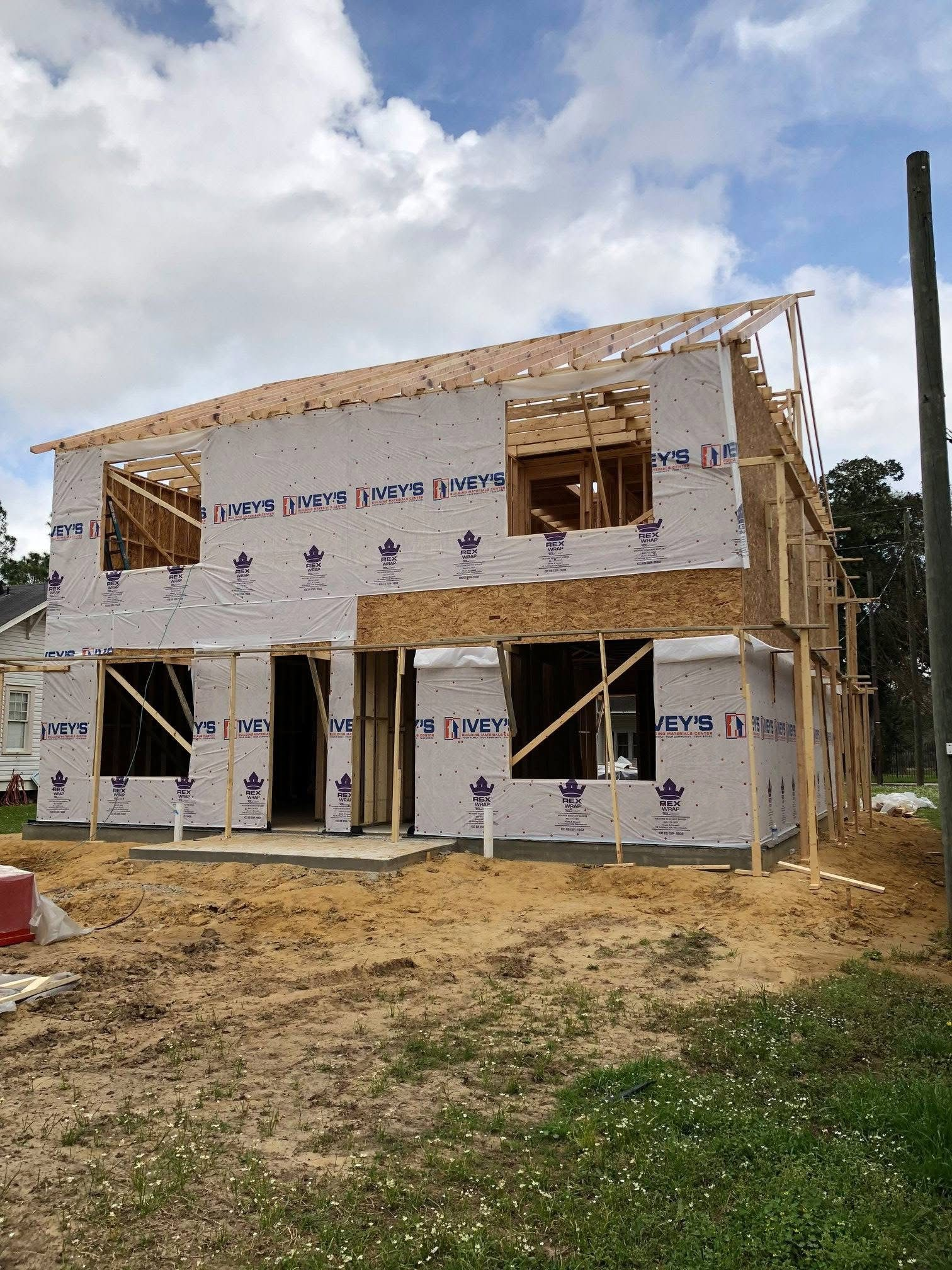 Two-story home under framing with house wrap over the exterior sheathing