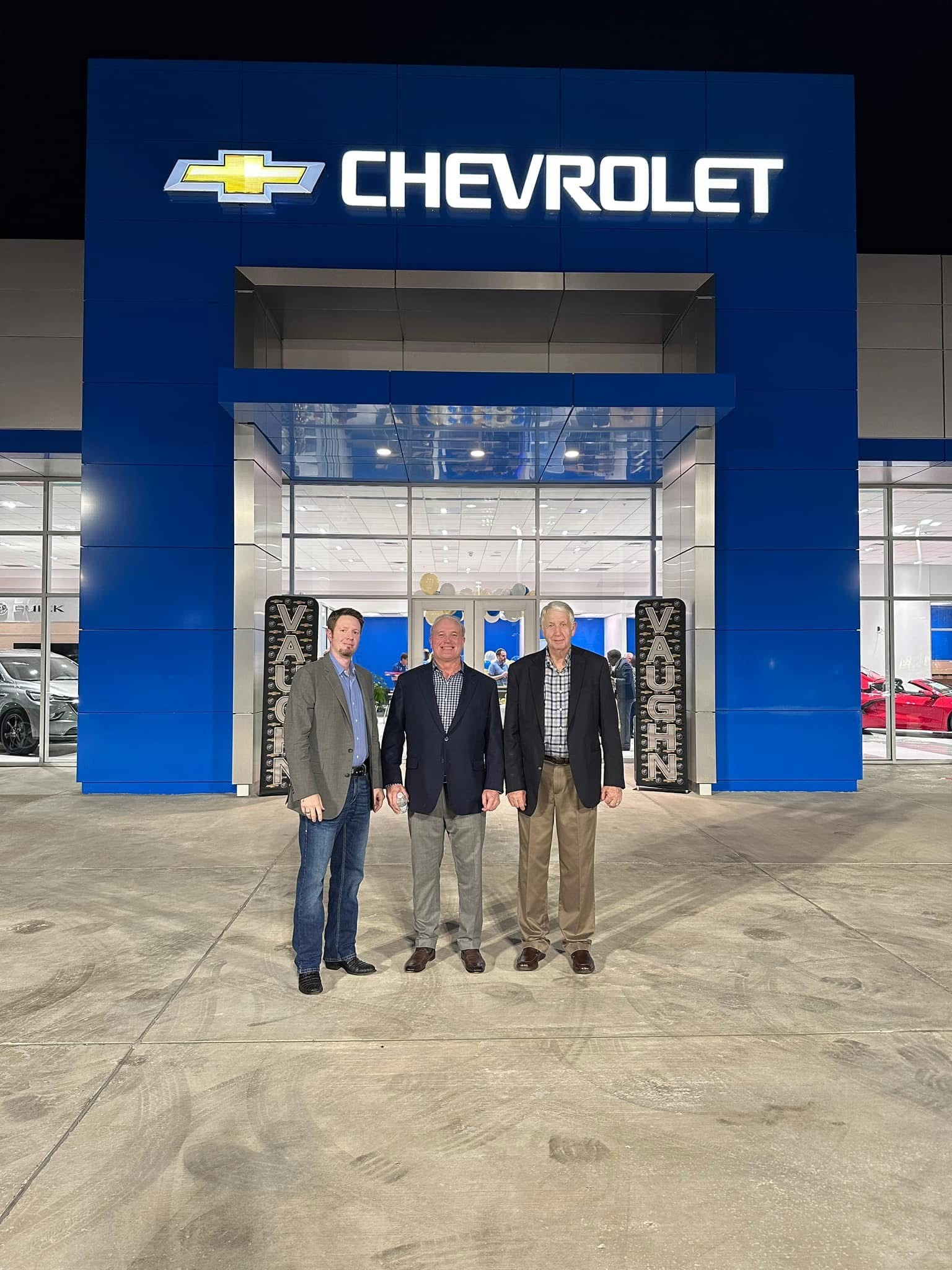 Vaughn Chevrolet dealership facade at night with illuminated bowtie signage