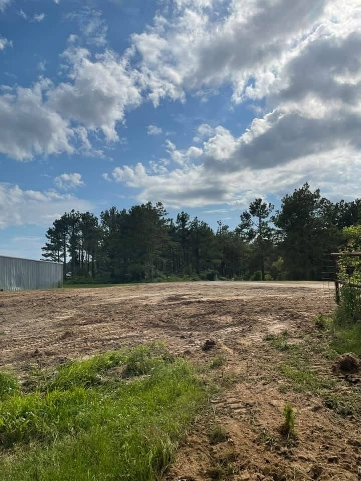 Cleared and graded building pad prepared by Smith Global for commercial construction