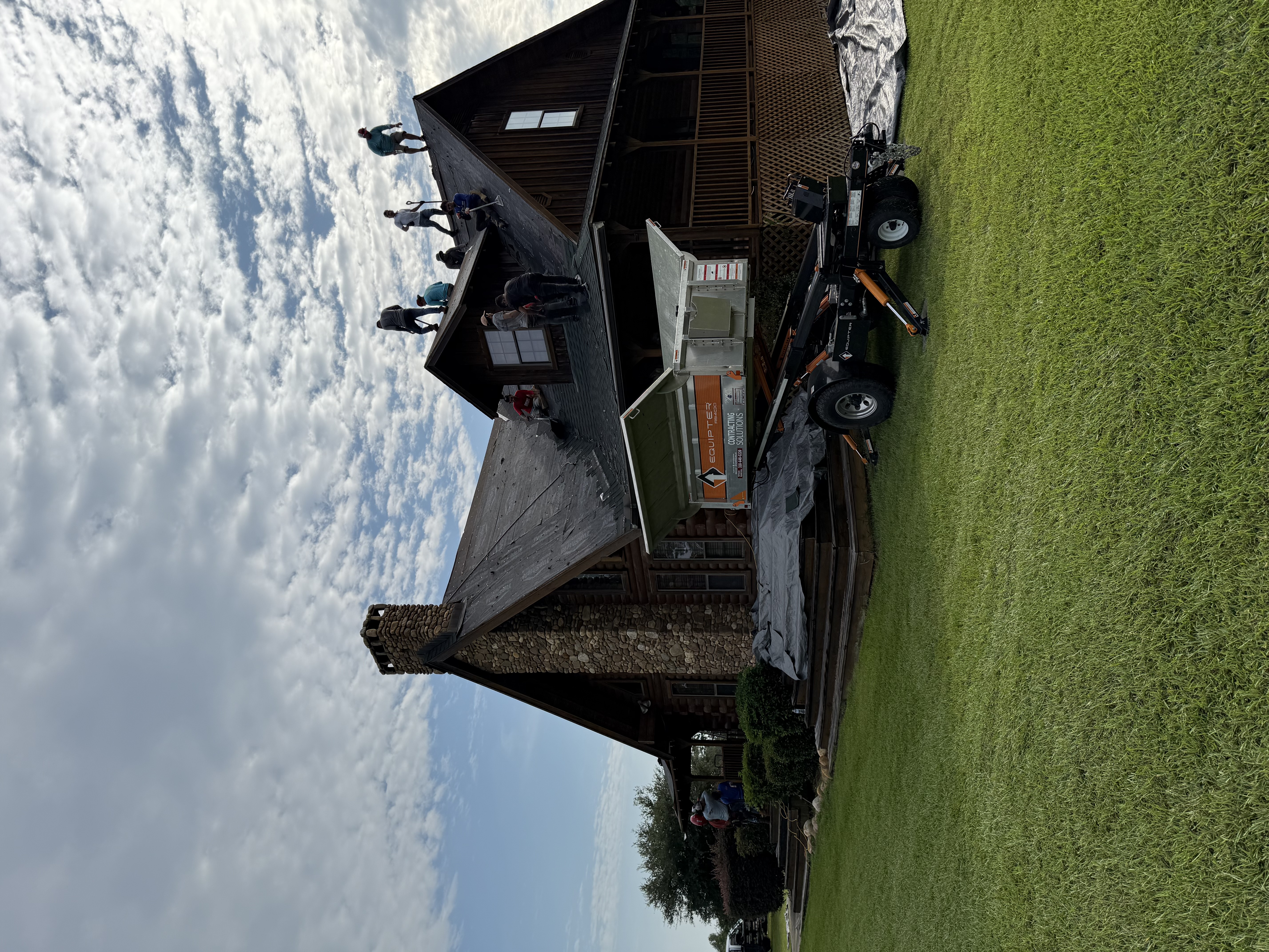 Smith Global roofing crew replacing shingles on a residential roof