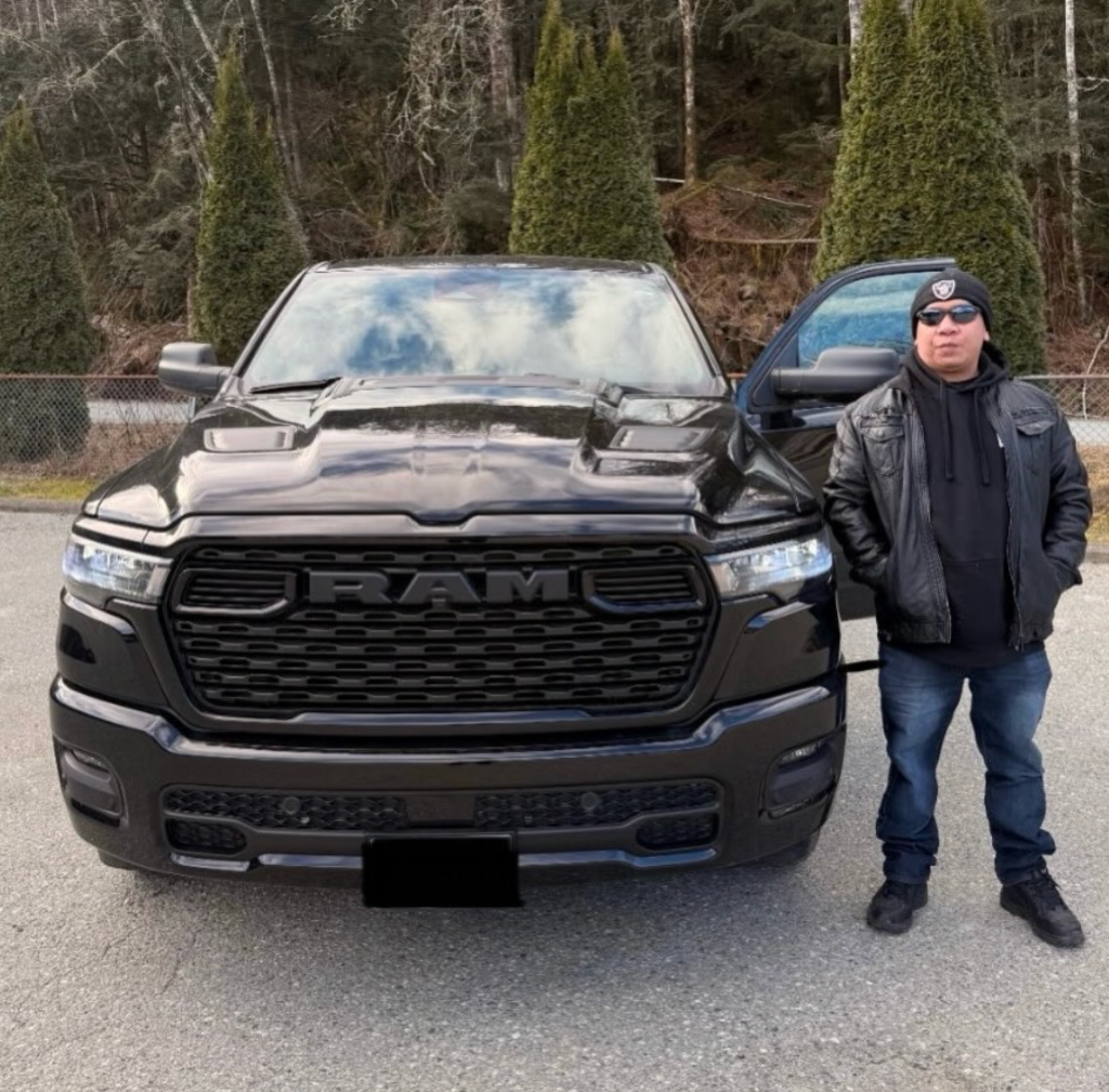 Travis with their new vehicle