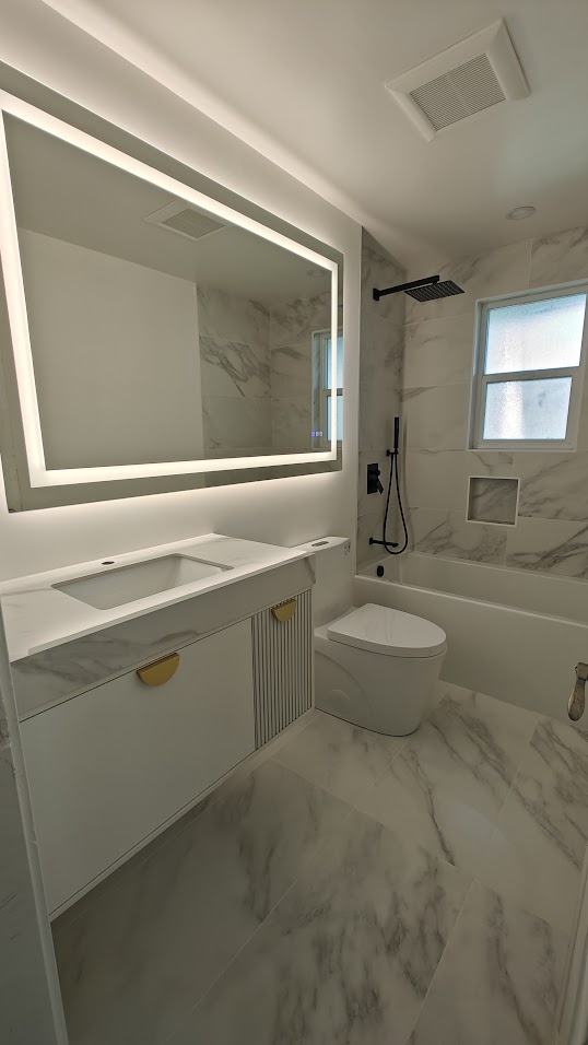 White Marble Bathroom with LED Mirror and Tub Renovation Kirkland WA