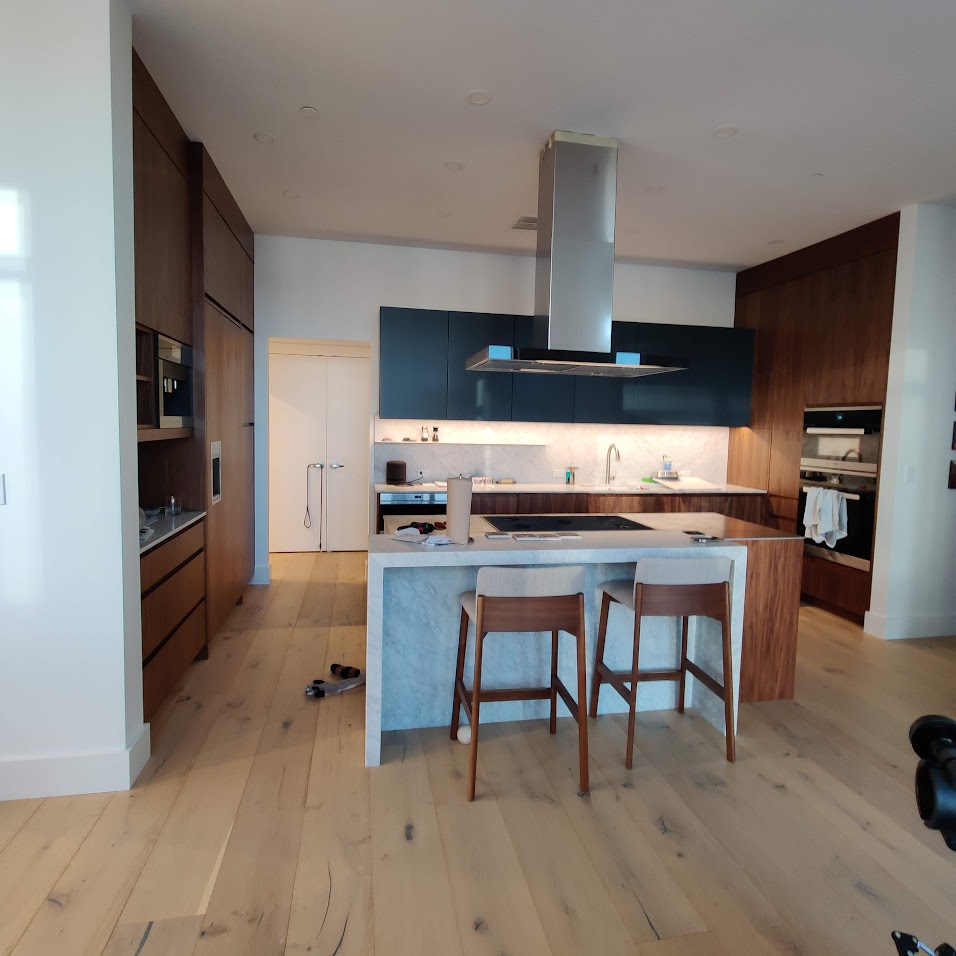 Luxury Modern Kitchen with Walnut Cabinets and Marble Island Bellevue WA