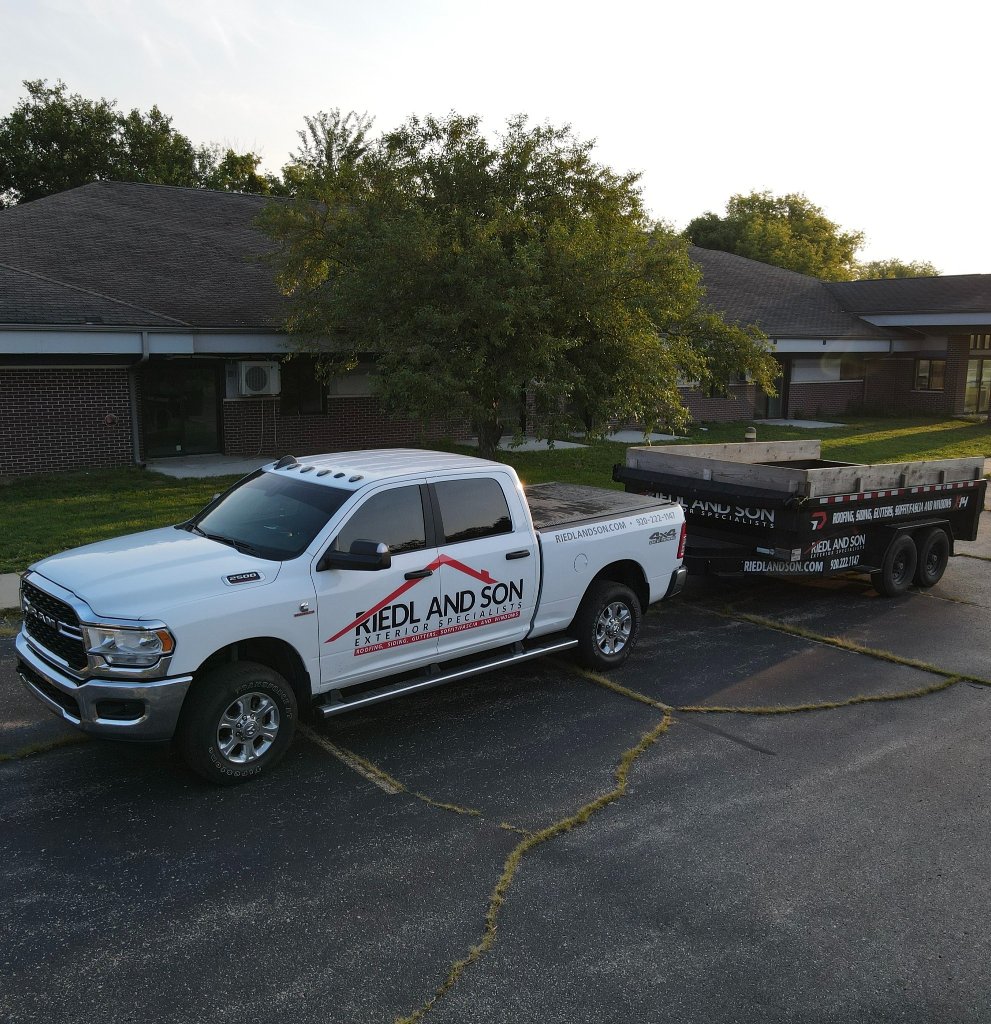 Riedl and Son team member with homeowner