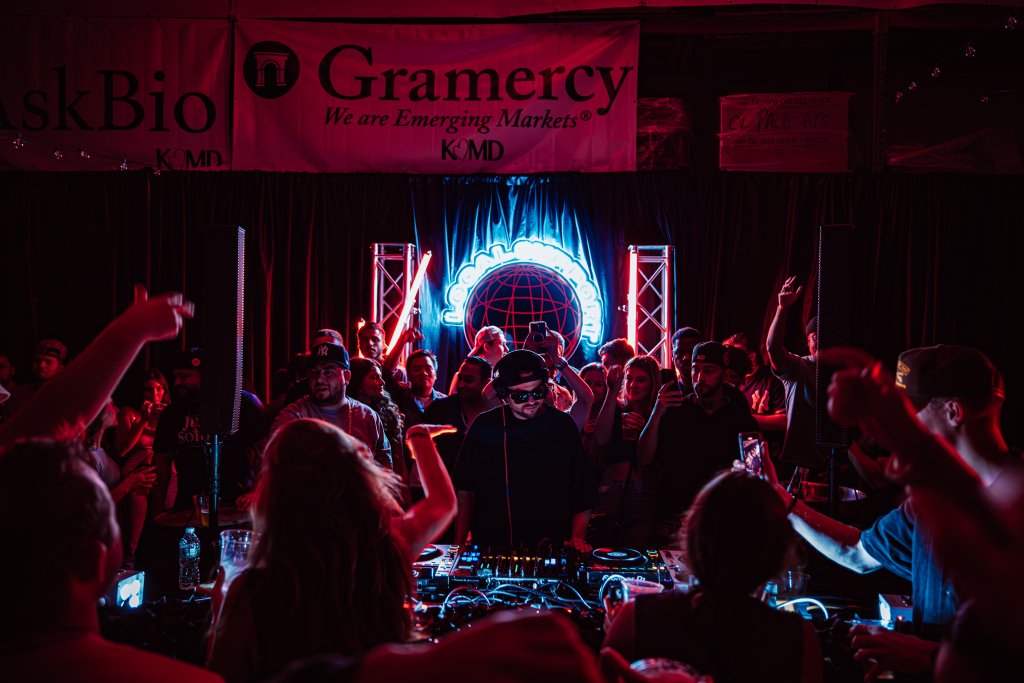 DJ performing to a packed crowd at Gramercy event