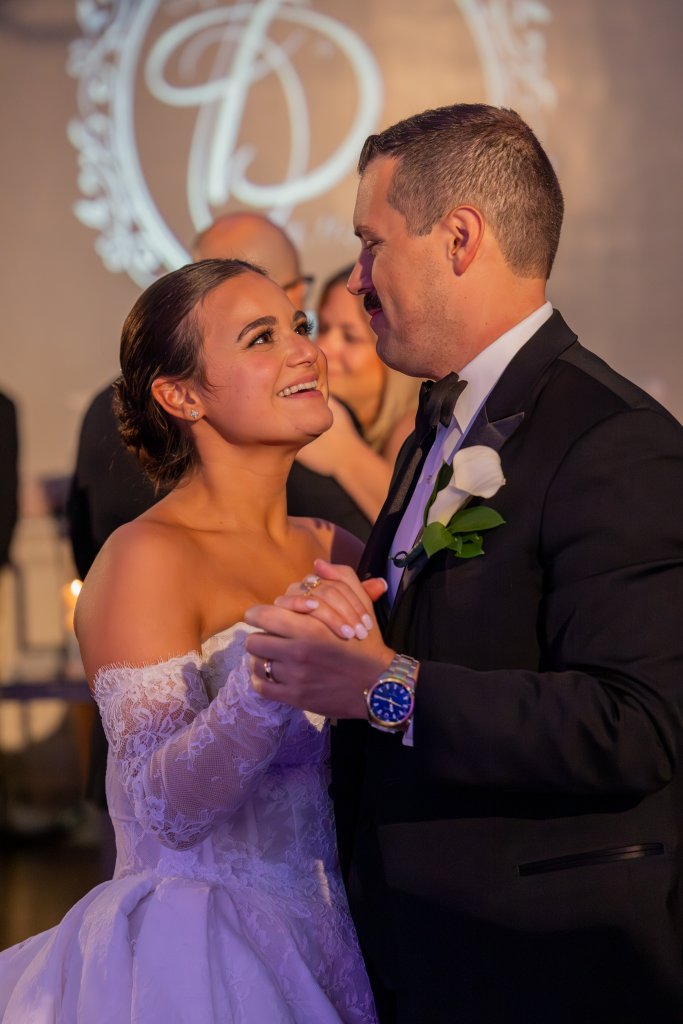 Bride and groom sharing their first dance at wedding reception