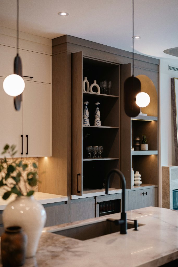 Elegant kitchen with timber cabinetry and marble island