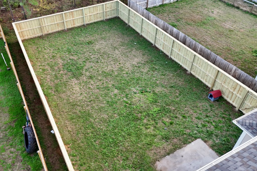 Aerial view of privacy fence enclosing backyard