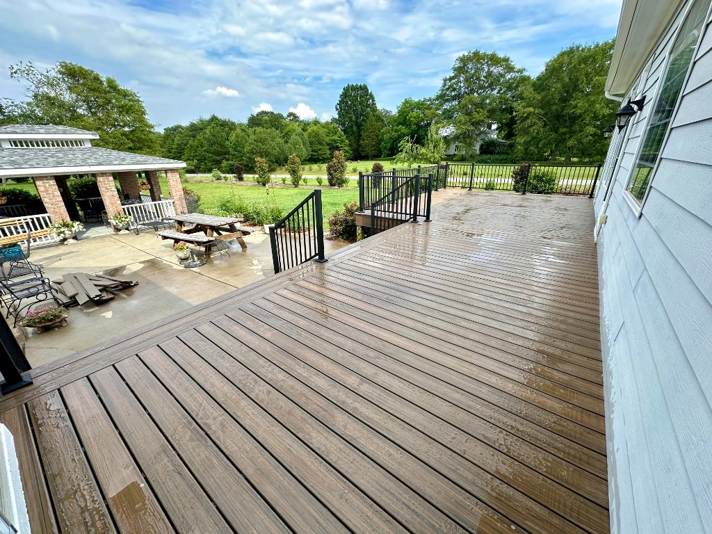 Large brown composite deck with pergola