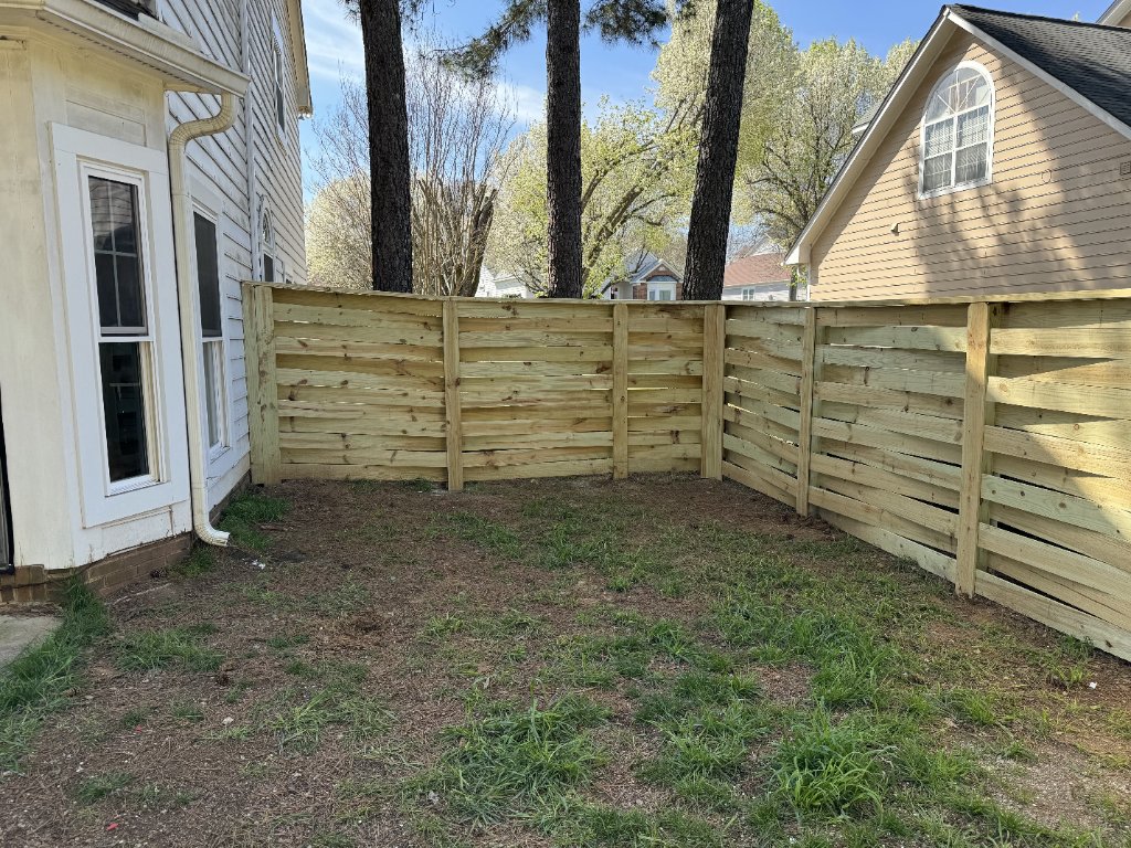 Horizontal slat fence in side yard