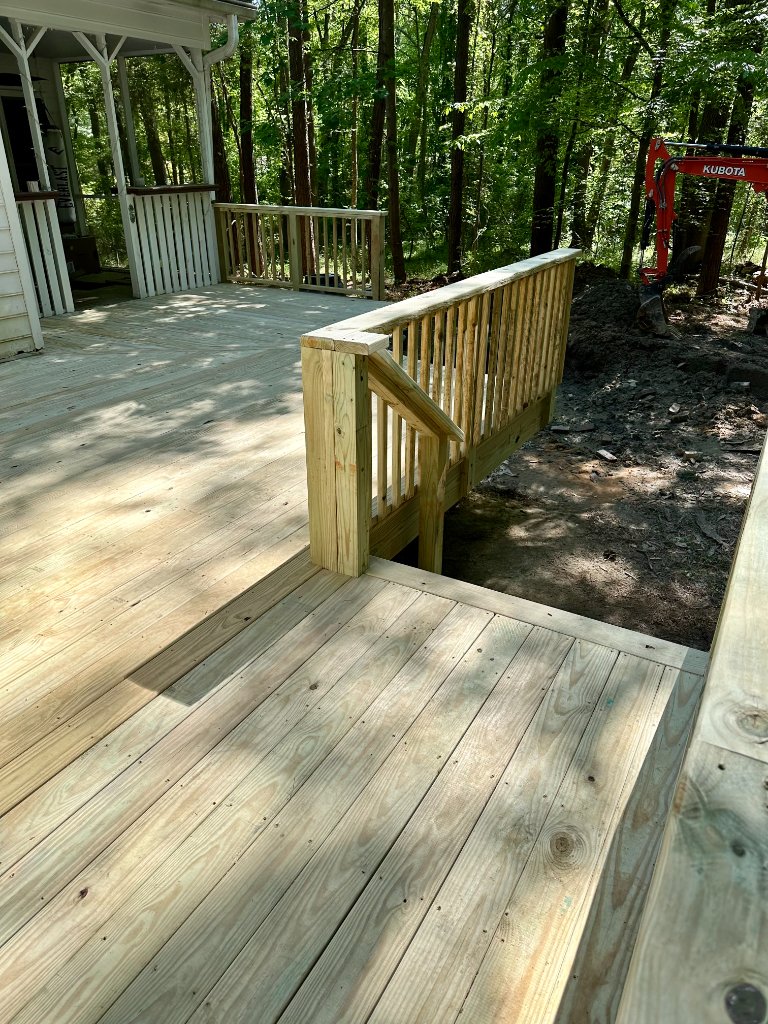 Fresh wood deck in wooded backyard