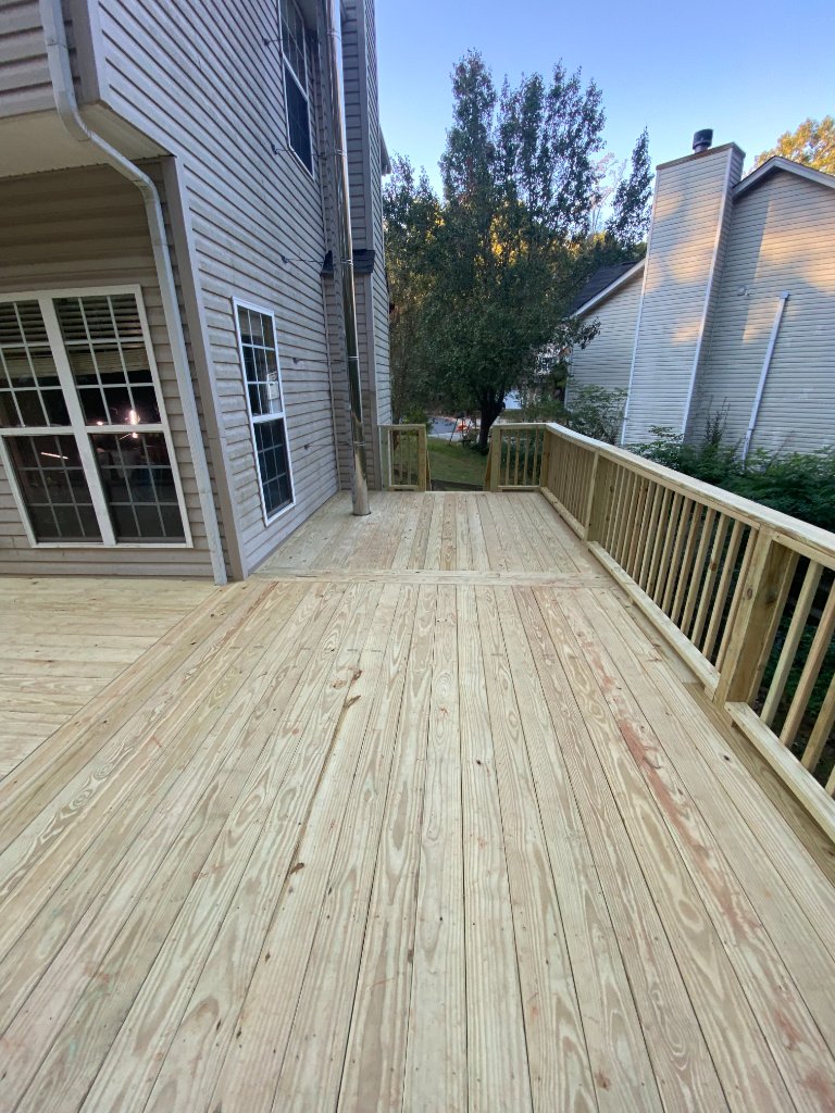 Side entry wood deck at dusk