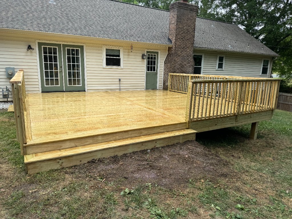 Ground level wood deck with French doors