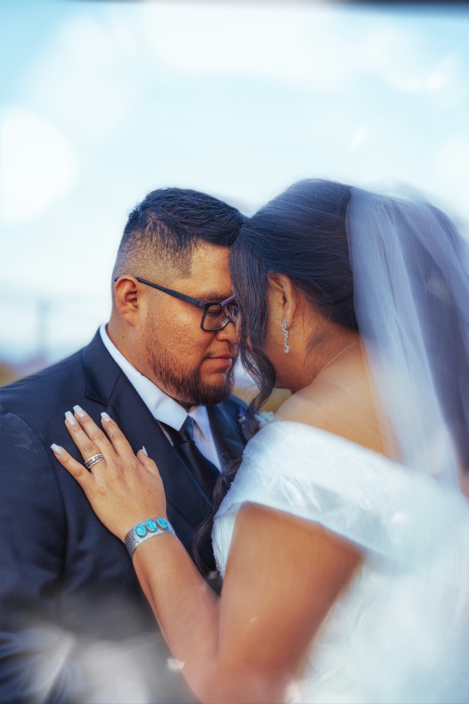 Intimate couple moment under veil